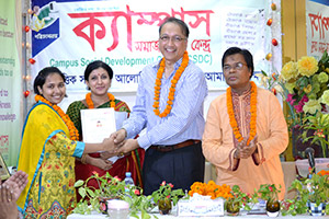 President of REHAB, Mukarram Hussain Khan, gives Certificates to the Trainees of Free Computer Training (Batch 128) as Chief Guest; Dr. M Helal is presiding over. (2014)